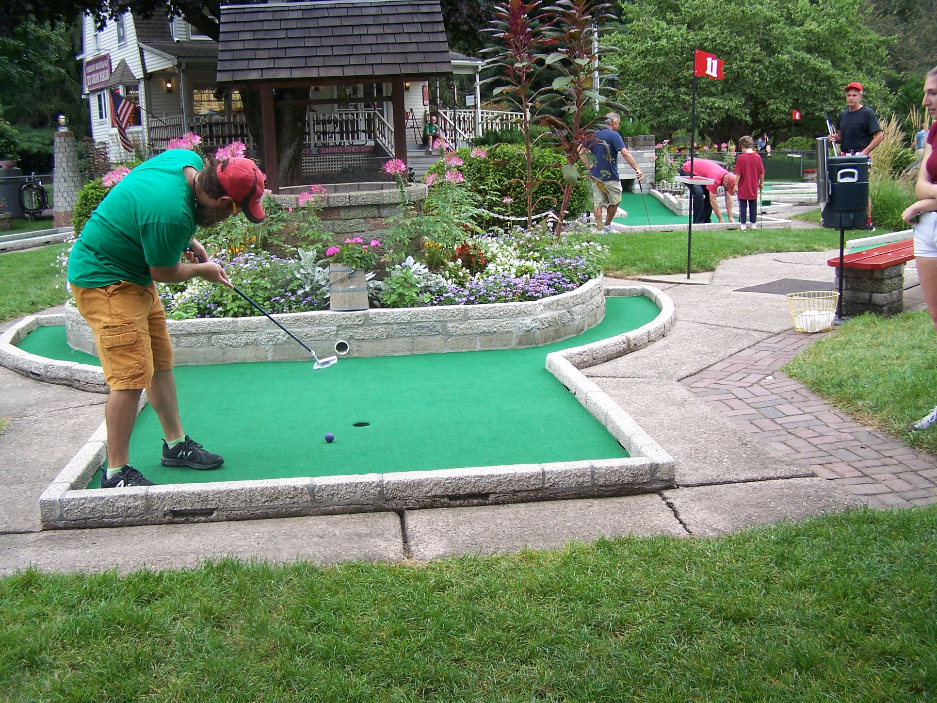 Players enjoying miniature golf at Farmington